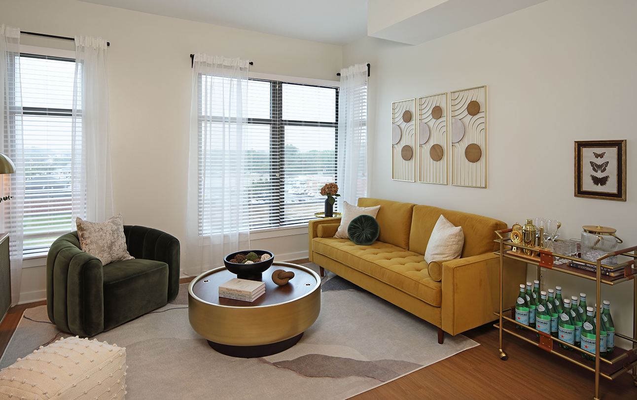 The Milton apartments living room with large windows